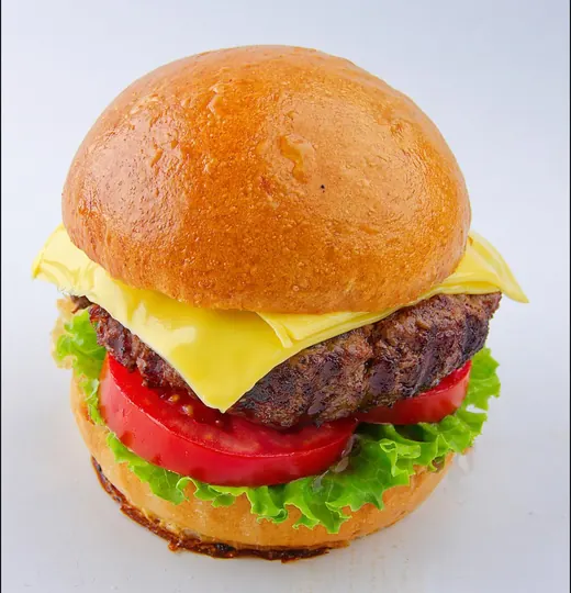 Hamburguesa Clásica de Tostado con queso fundido, lechuga y tomate